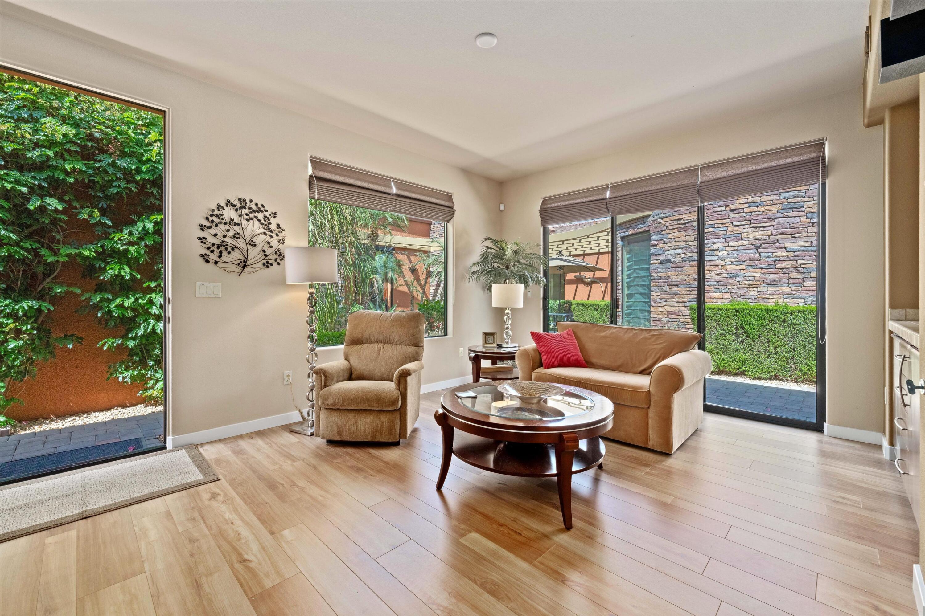 79625 Vía Sin Cuidado La Quinta, CA 92253 - Photo 47 of 52 a living room with furniture and a wooden floor