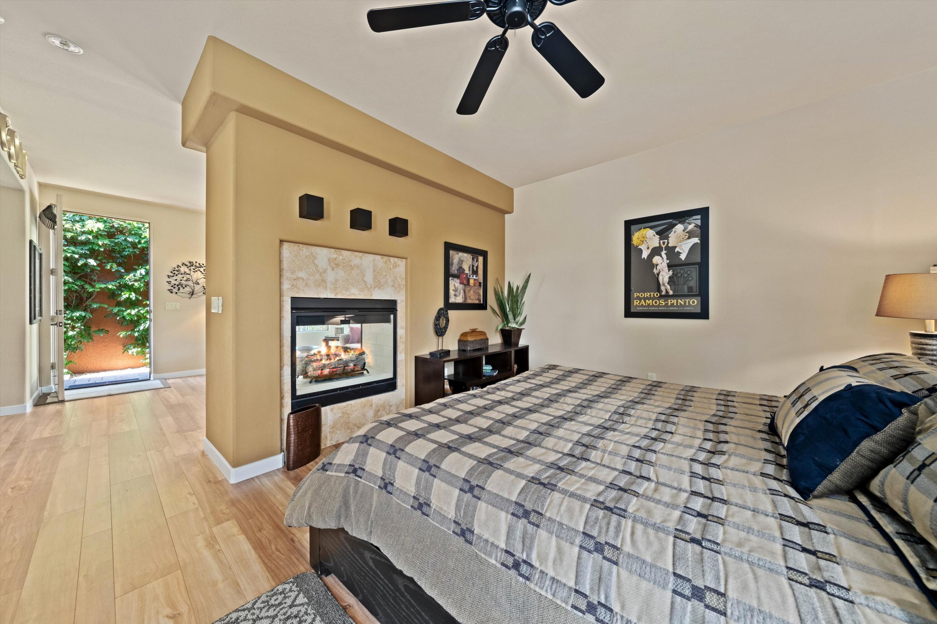 79625 Vía Sin Cuidado La Quinta, CA 92253 - Photo 50 of 52 a bedroom with a bed and a chandelier