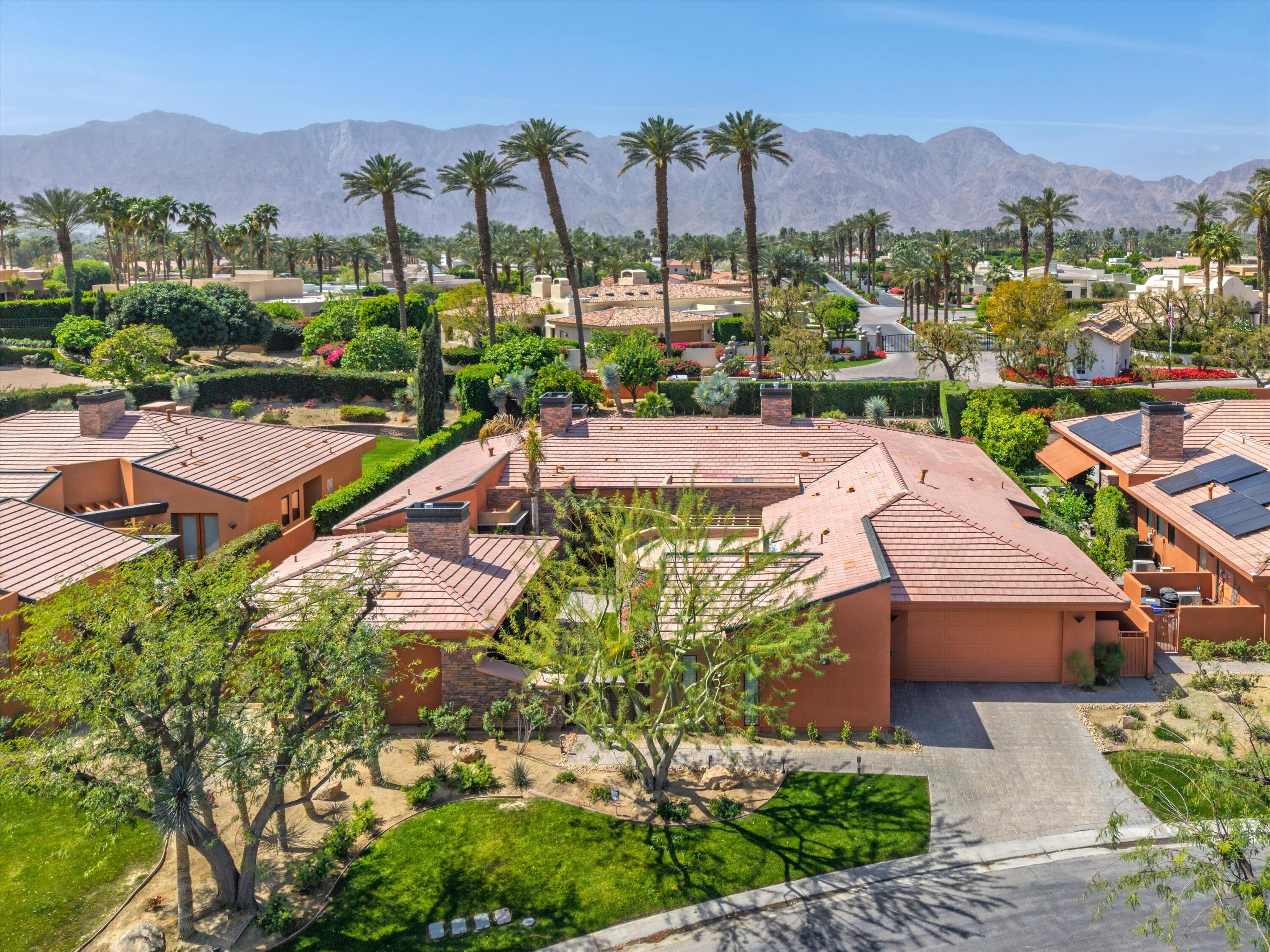 79625 Vía Sin Cuidado La Quinta, CA 92253 - Photo 52 of 52 an aerial view of residential houses with outdoor space and a street view