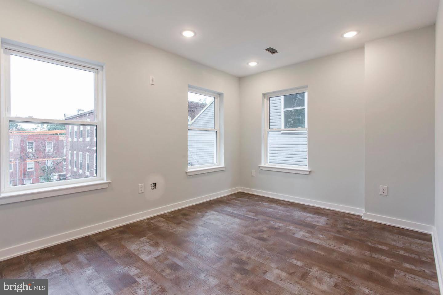 1318 South Broad Street, Unit 2R Philadelphia, PA 19146 - Photo 4 of 11 a view of an empty room with a window
