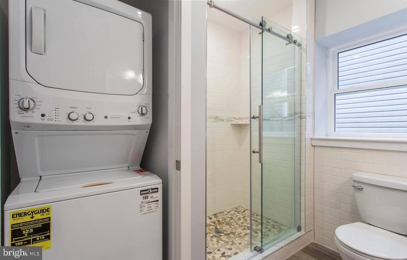 1318 South Broad Street, Unit 2R Philadelphia, PA 19146 - Photo 9 of 11 a bathroom with a toilet and a shower