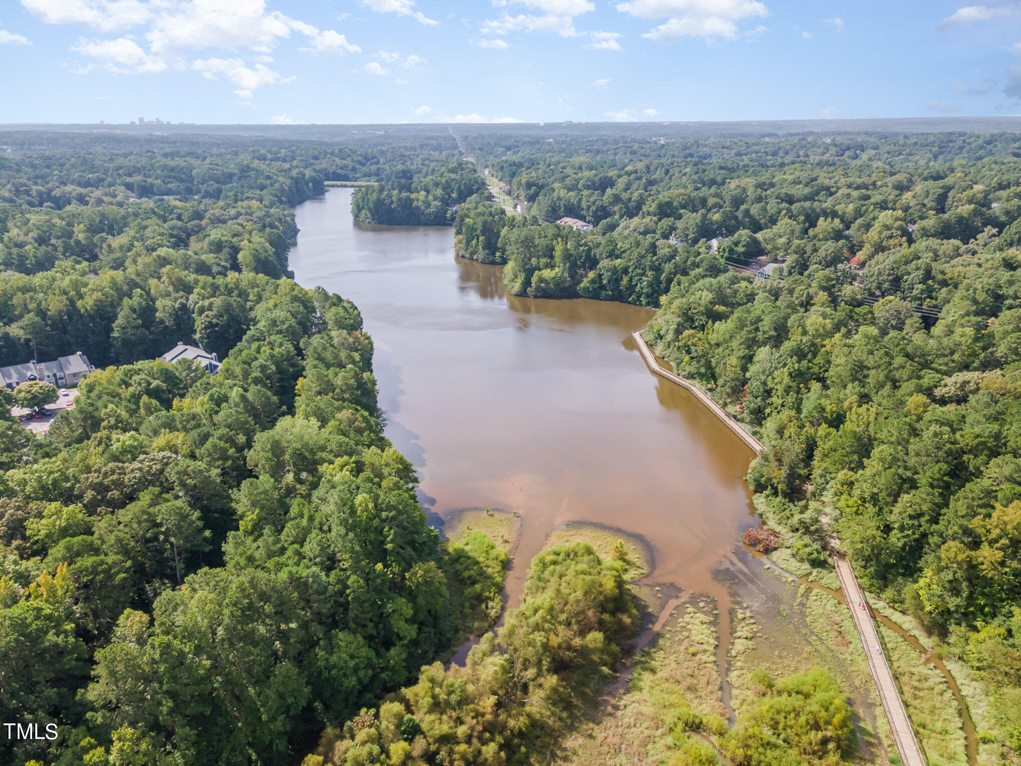 3008 Dunkirk Drive Raleigh, NC 27613 - Photo 26 of 33 an aerial view of a house with a yard and lake view in back