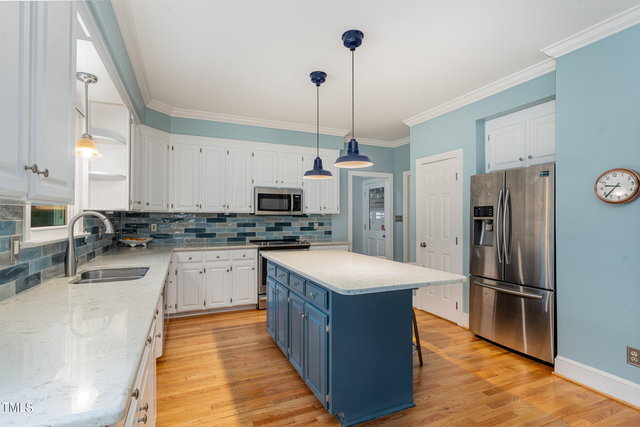 3008 Dunkirk Drive Raleigh, NC 27613 - Photo 6 of 33 a kitchen with stainless steel appliances granite countertop a refrigerator a sink a stove a microwave and island