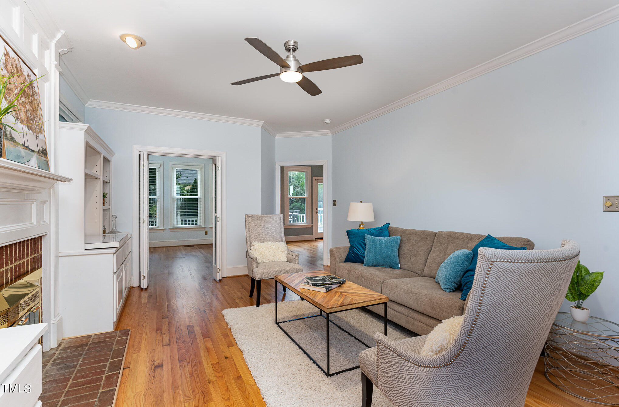 3008 Dunkirk Drive Raleigh, NC 27613 - Photo 7 of 33 a living room with furniture and a wooden floor