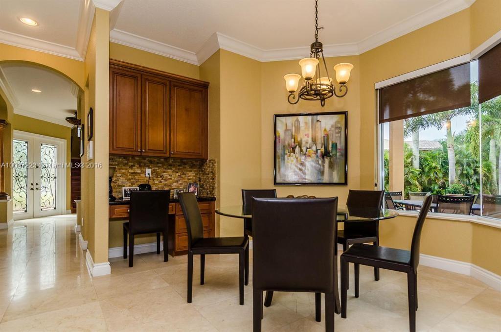 2633 Birch Terrace Davie, FL 33330 - Photo 11 of 35 a dining room with furniture a chandelier and window