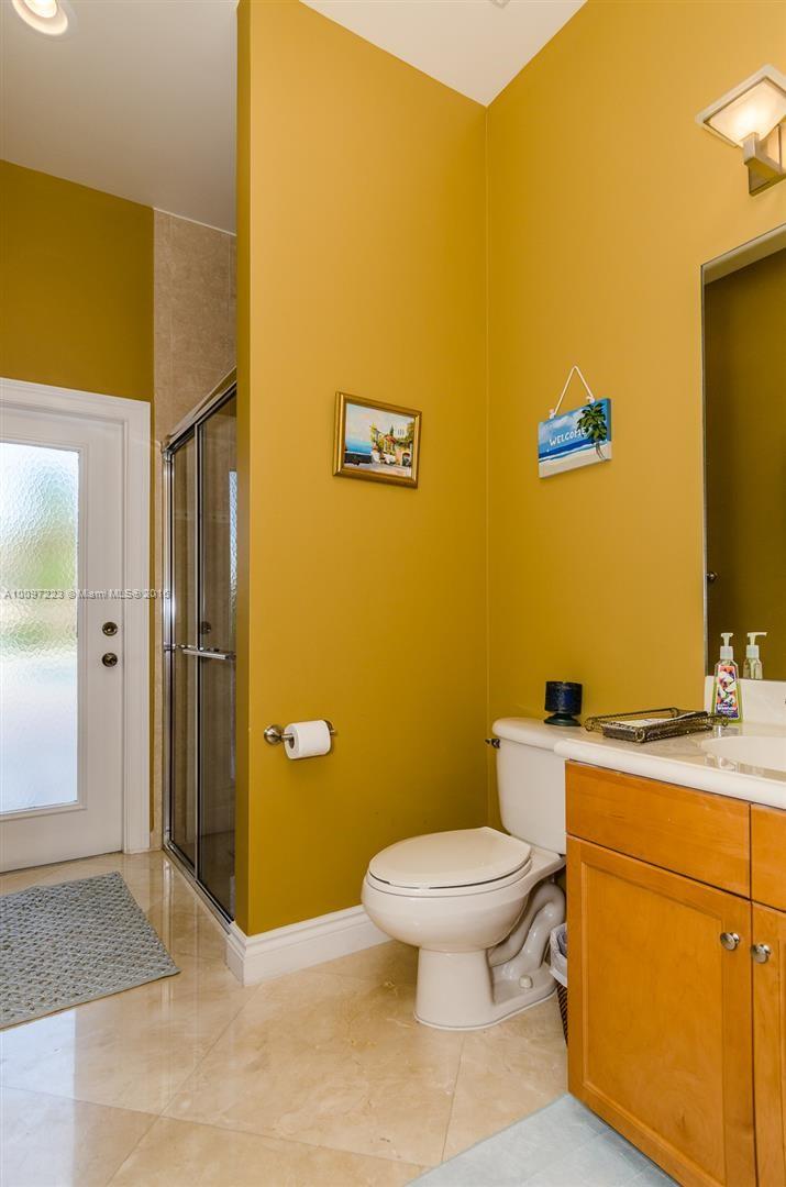 2633 Birch Terrace Davie, FL 33330 - Photo 17 of 35 a bathroom with a granite countertop toilet and a sink