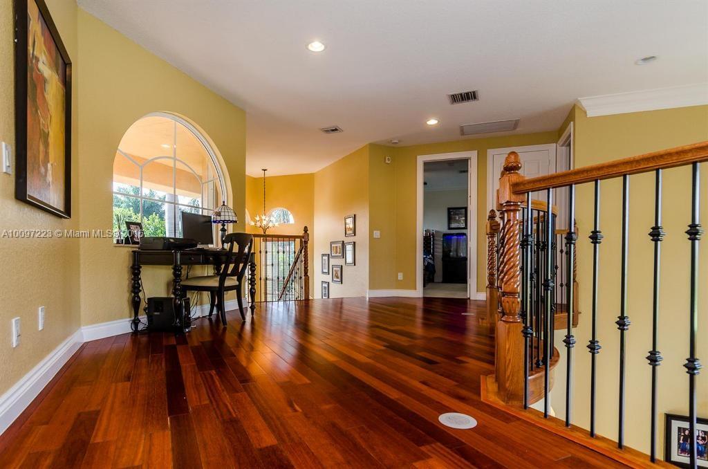 2633 Birch Terrace Davie, FL 33330 - Photo 20 of 35 a view of a livingroom with furniture wooden floor and a table