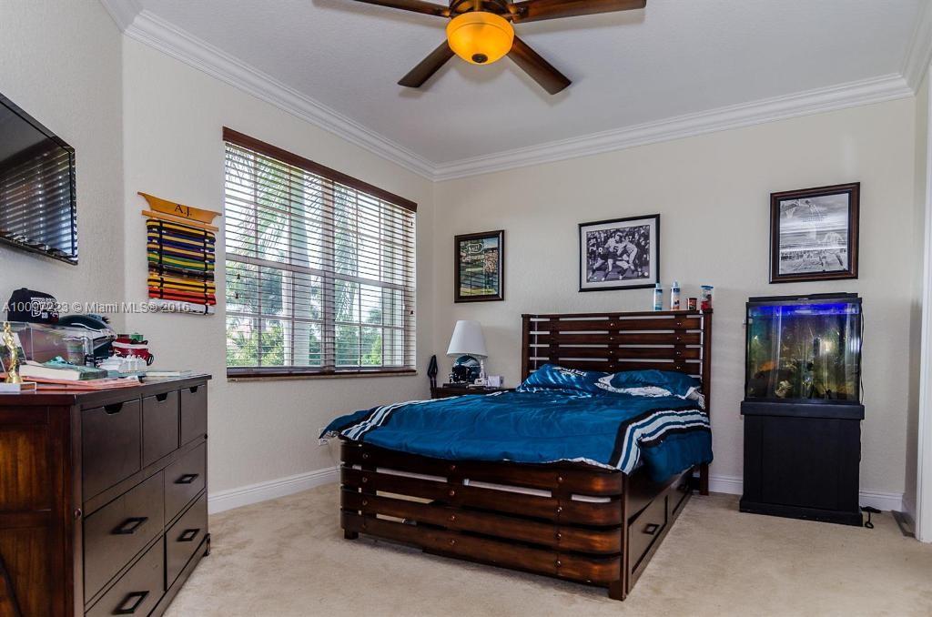 2633 Birch Terrace Davie, FL 33330 - Photo 21 of 35 a bedroom with a bed and a window