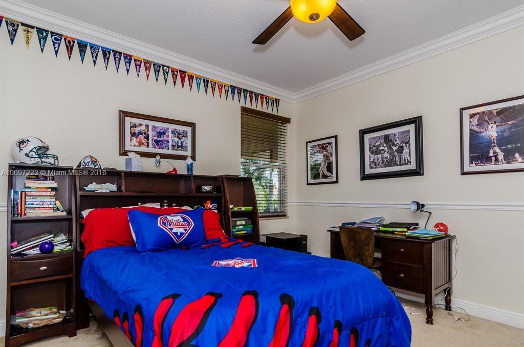 2633 Birch Terrace Davie, FL 33330 - Photo 23 of 35 a bedroom with a bed and wooden floor