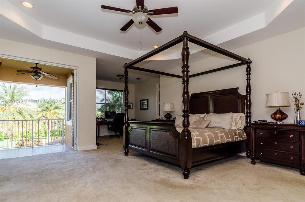 2633 Birch Terrace Davie, FL 33330 - Photo 24 of 35 a bedroom with a bed window and a walk in closet