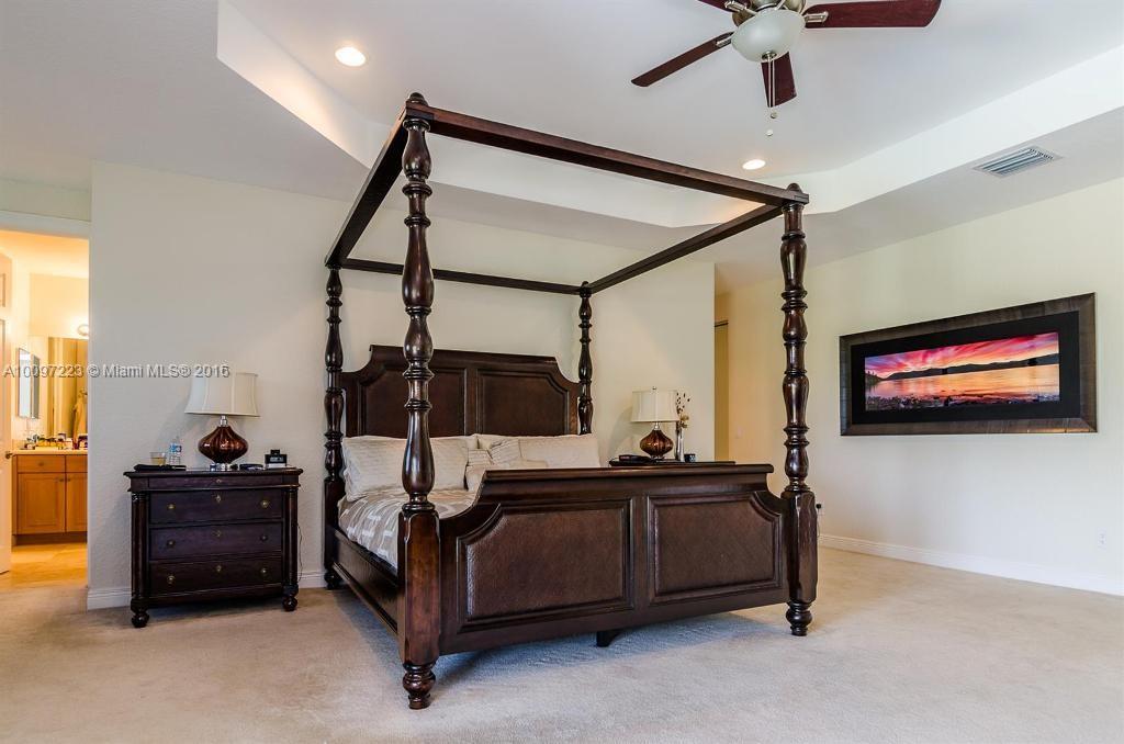 2633 Birch Terrace Davie, FL 33330 - Photo 25 of 35 a bedroom with furniture and a flat screen tv