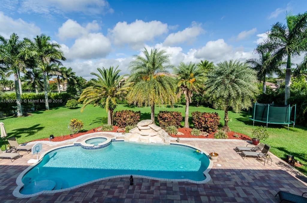 2633 Birch Terrace Davie, FL 33330 - Photo 26 of 35 a view of a swimming pool with a yard