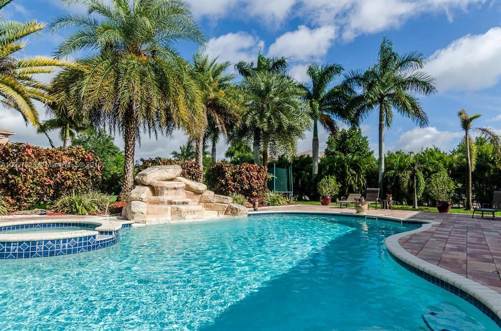 2633 Birch Terrace Davie, FL 33330 - Photo 30 of 35 a view of a house with a yard and palm trees