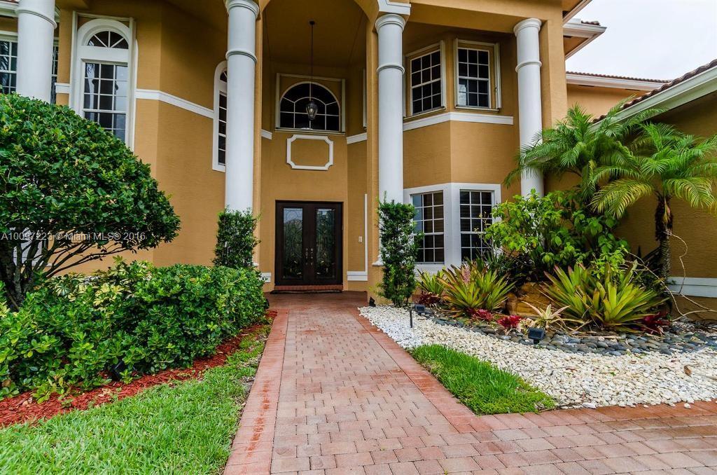 2633 Birch Terrace Davie, FL 33330 - Photo 3 of 35 a front view of a house with a yard