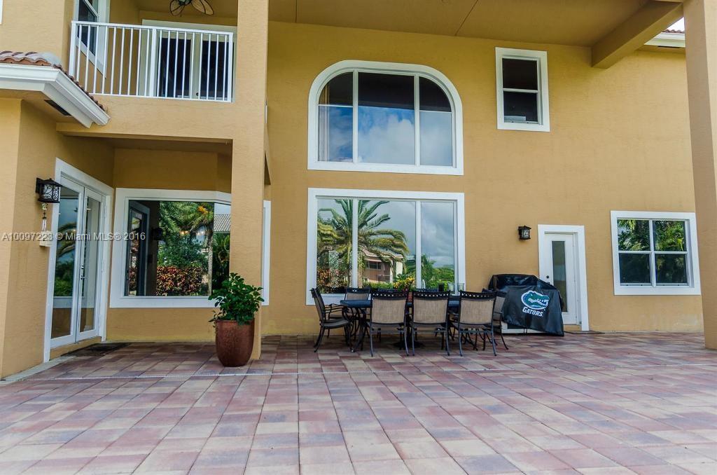 2633 Birch Terrace Davie, FL 33330 - Photo 31 of 35 a view of house with outdoor seating space and wooden floor