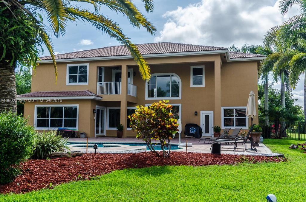 2633 Birch Terrace Davie, FL 33330 - Photo 33 of 35 a front view of a house with a garden