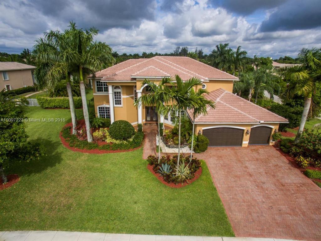 2633 Birch Terrace Davie, FL 33330 - Photo 34 of 35 a view of a house with backyard sitting area and garden