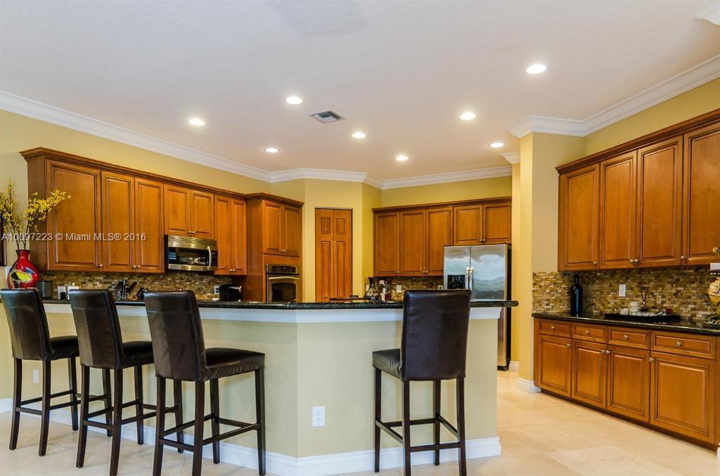 2633 Birch Terrace Davie, FL 33330 - Photo 7 of 35 a kitchen with lots of counter top space and stainless steel appliances