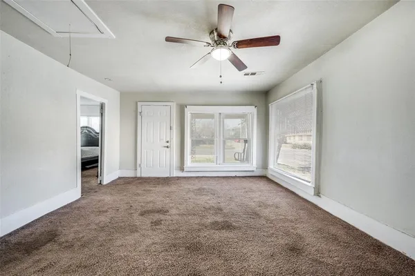 a view of an empty room with a window