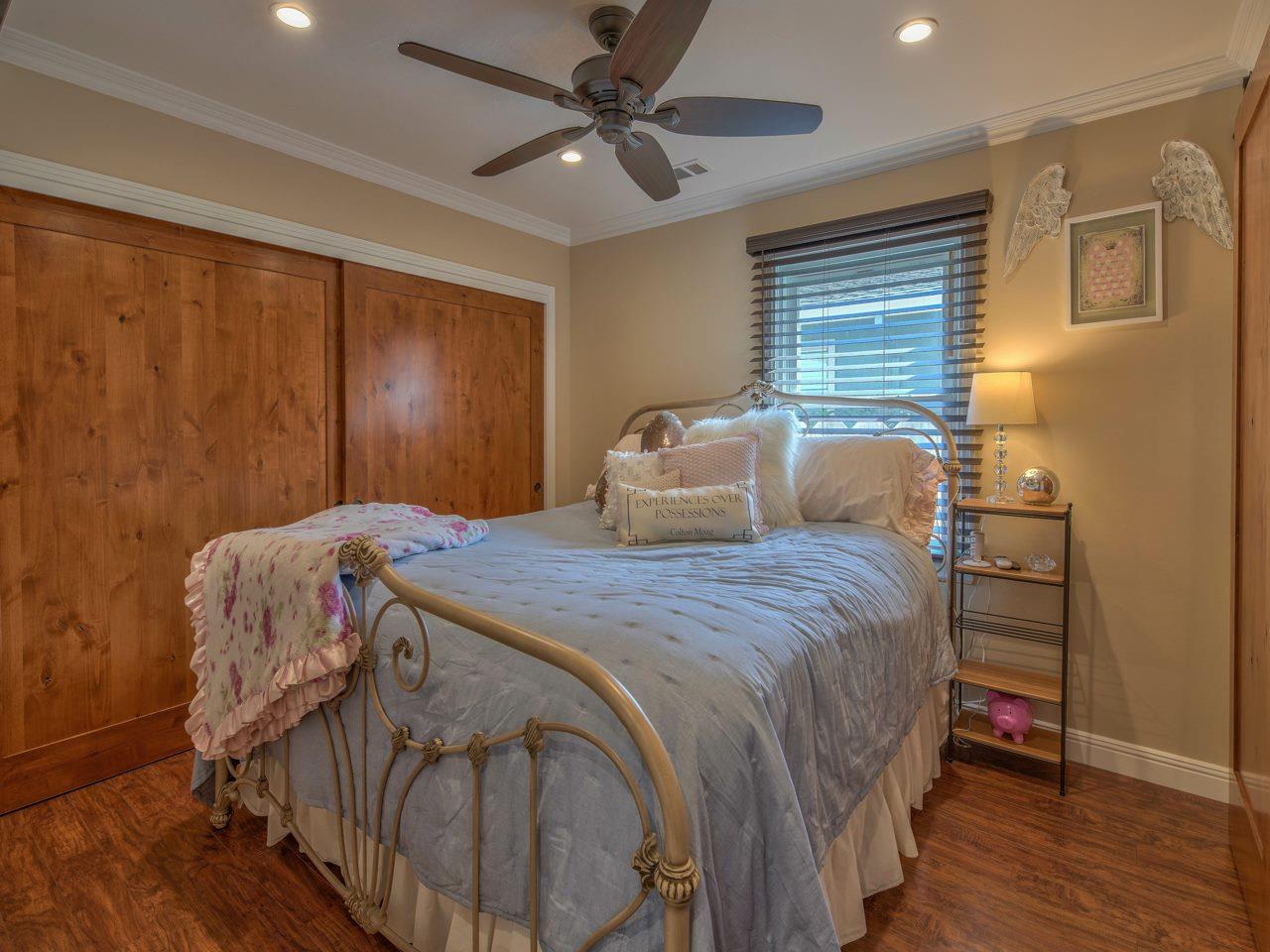 185 Riker Terrace Salinas, CA 93901 - Photo 13 of 19 a bedroom with a bed and wooden floor