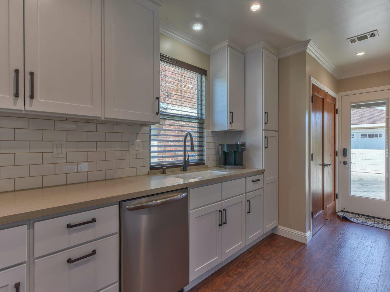 185 Riker Terrace Salinas, CA 93901 - Photo 8 of 19 a kitchen with granite countertop white cabinets and white appliances