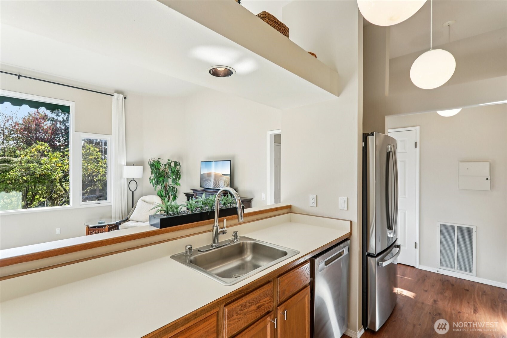 4222 221st Place Southeast, Unit 1081 Issaquah, WA 98029 - Photo 14 of 40 a bathroom with a granite countertop sink and a large mirror