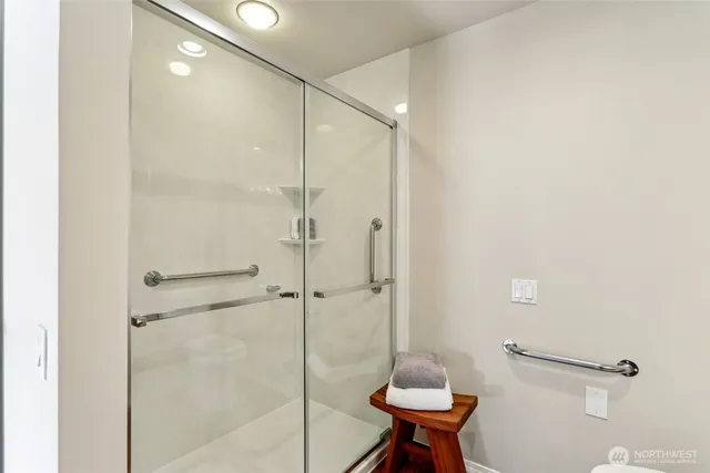 a bathroom with a shower and a toilet