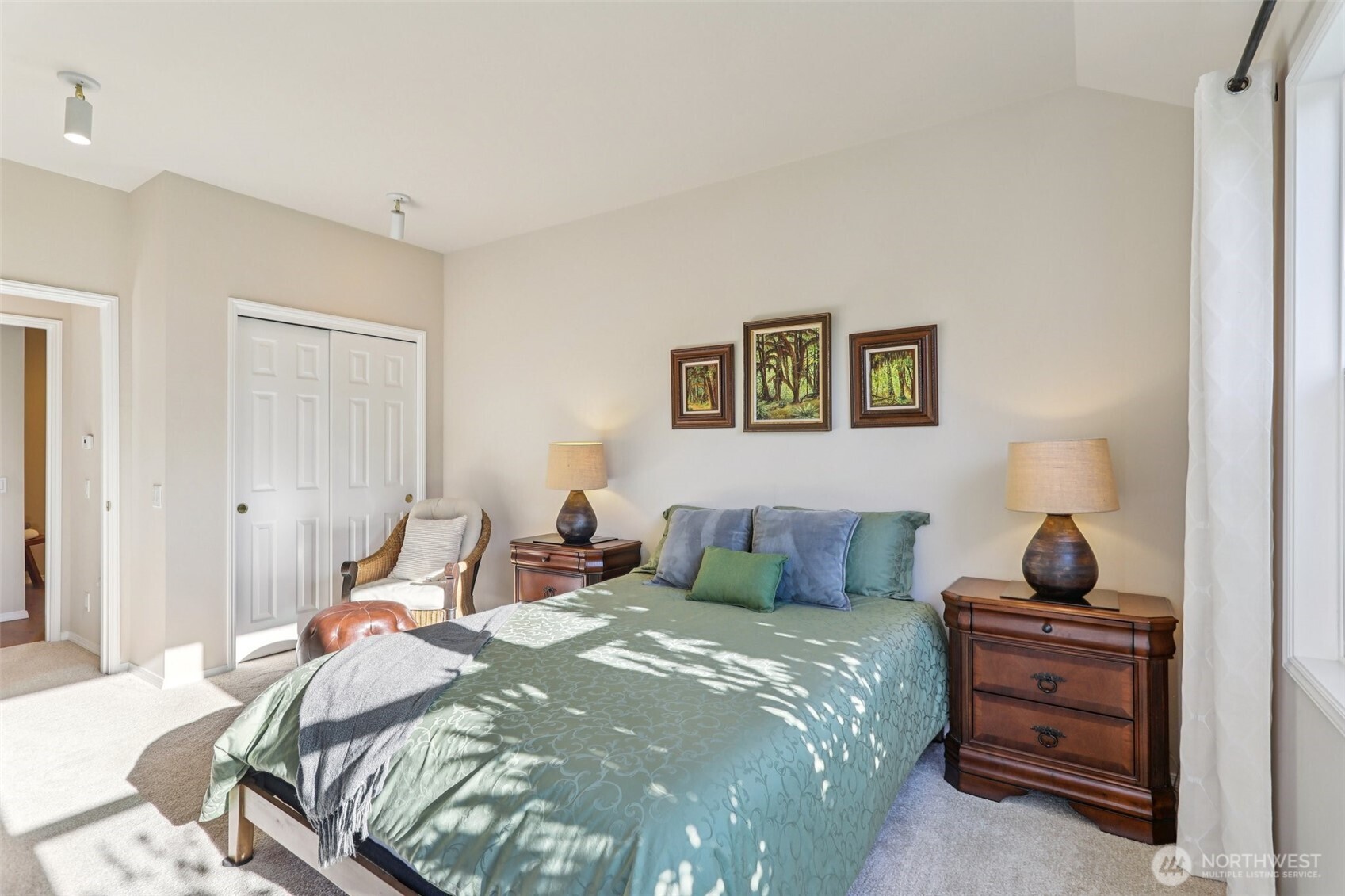 4222 221st Place Southeast, Unit 1081 Issaquah, WA 98029 - Photo 23 of 40 a bedroom with a bed and ceiling fan