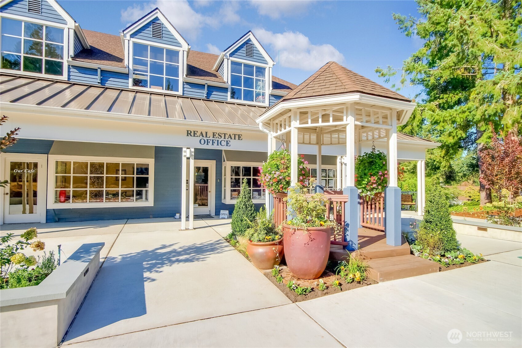 4222 221st Place Southeast, Unit 1081 Issaquah, WA 98029 - Photo 40 of 40 a front view of a house with a yard and potted plants