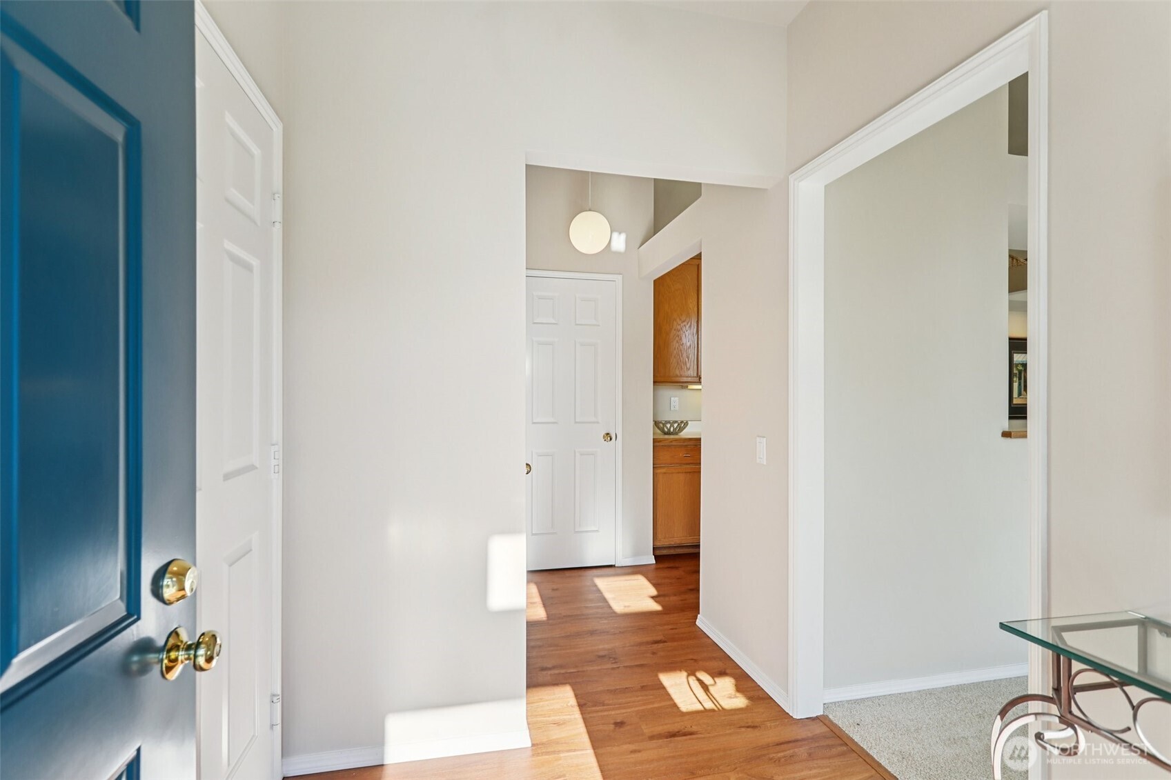 4222 221st Place Southeast, Unit 1081 Issaquah, WA 98029 - Photo 7 of 40 a view of a hallway with entryway with wooden floor