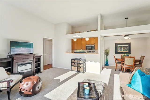 a bedroom with furniture and a flat screen tv
