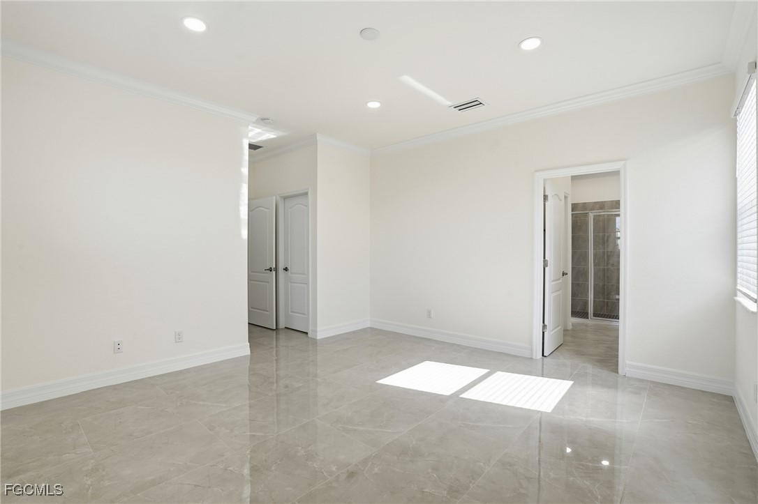 2251 Dancy Street Naples, FL 34120 - Photo 12 of 28 an empty room with a natural light