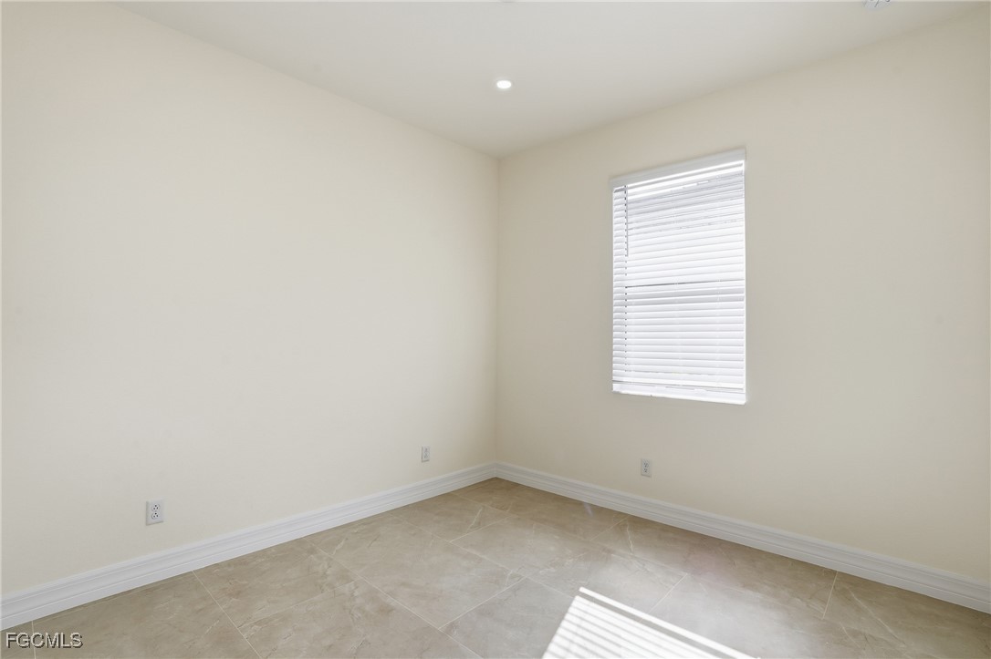 2251 Dancy Street Naples, FL 34120 - Photo 15 of 28 an empty room with a window
