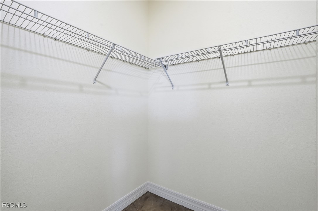 2251 Dancy Street Naples, FL 34120 - Photo 16 of 28 a view of a room with racks on the wall