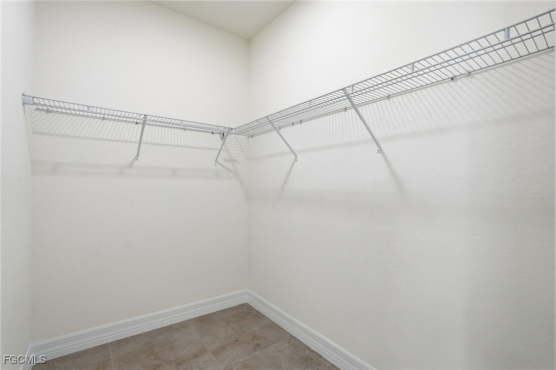 2251 Dancy Street Naples, FL 34120 - Photo 17 of 28 a view of a room with racks on the wall