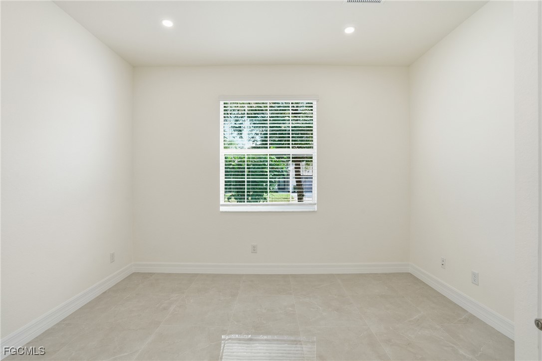 2251 Dancy Street Naples, FL 34120 - Photo 19 of 28 an empty room with a window