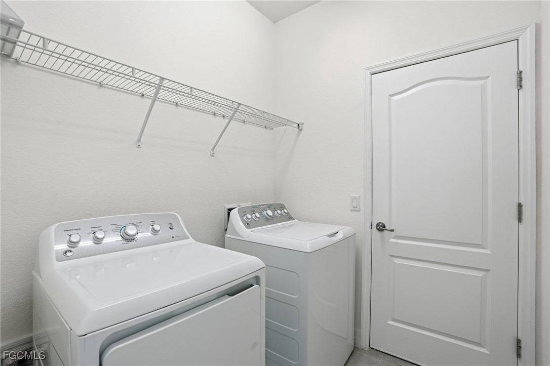 2251 Dancy Street Naples, FL 34120 - Photo 26 of 28 a utility room with dryer and washer