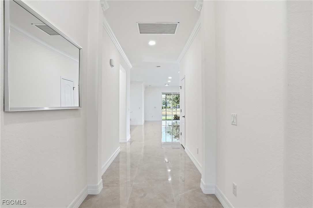 2251 Dancy Street Naples, FL 34120 - Photo 3 of 28 a view of a hallway with wooden floor and entryway