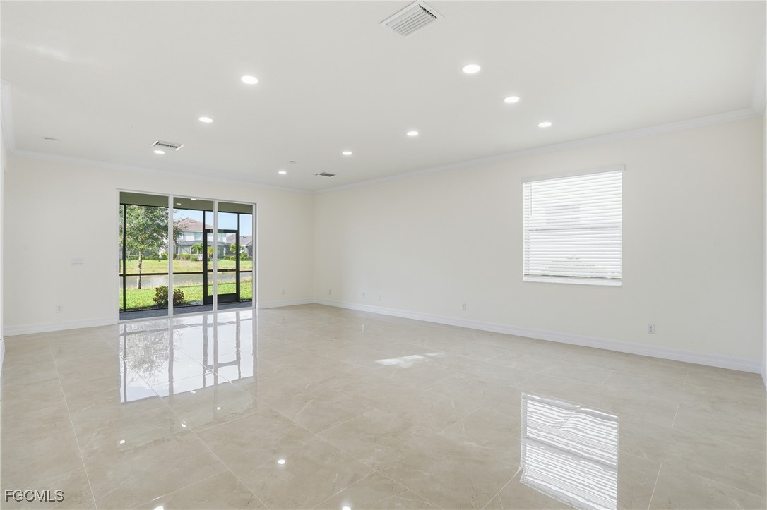 2251 Dancy Street Naples, FL 34120 - Photo 4 of 28 an empty room with windows
