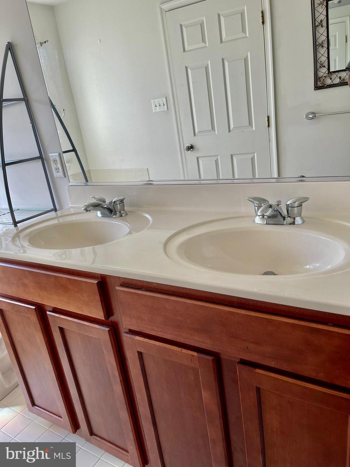 1047 Lily Way Odenton, MD 21113 - Photo 13 of 15 a bathroom with a sink and a mirror