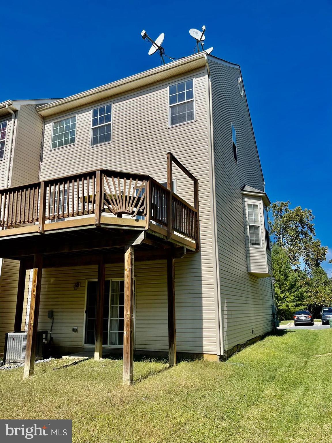 1047 Lily Way Odenton, MD 21113 - Photo 3 of 15 a view of a house with wooden deck