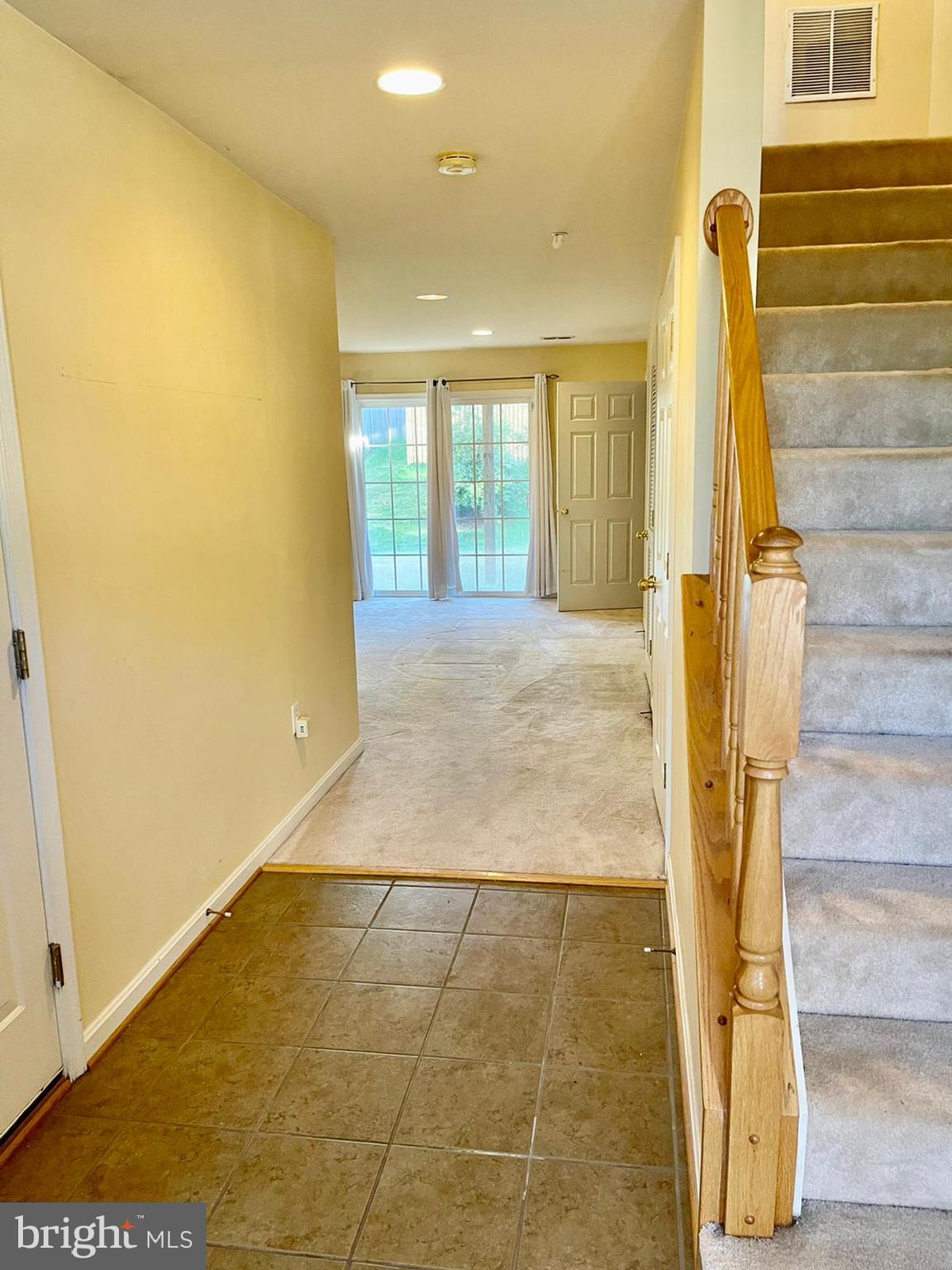 1047 Lily Way Odenton, MD 21113 - Photo 5 of 15 a view of a hall with an empty room