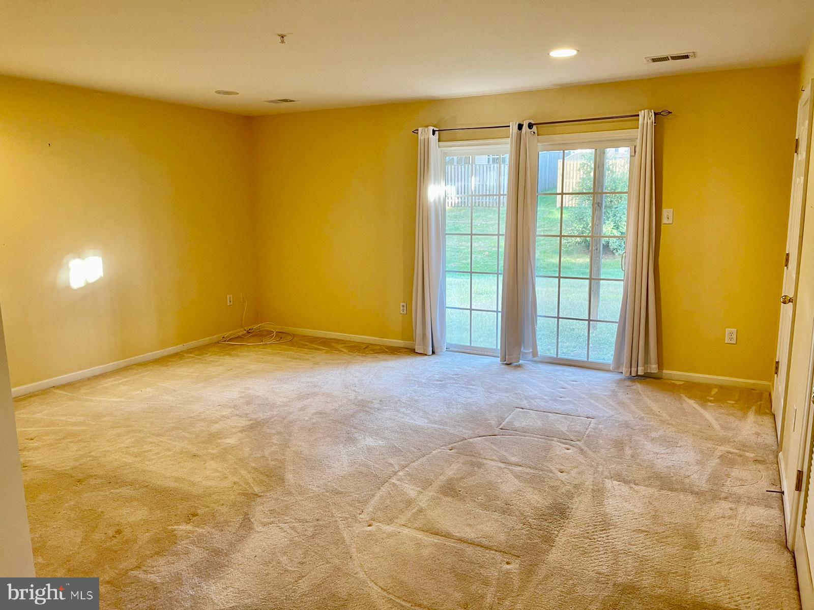 1047 Lily Way Odenton, MD 21113 - Photo 6 of 15 a view of an empty room with a window