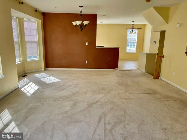 en empty room with windows