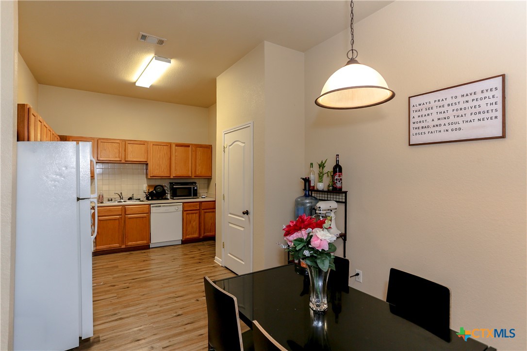 417 Clore Road Harker Heights, TX 76548 - Photo 8 of 22 a kitchen with a refrigerator and a sink