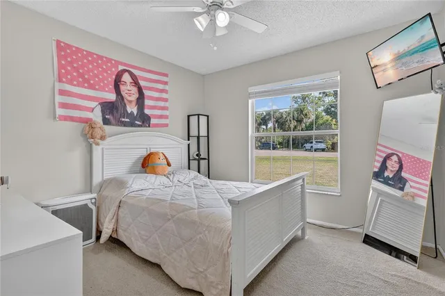 a bedroom with bed and a window