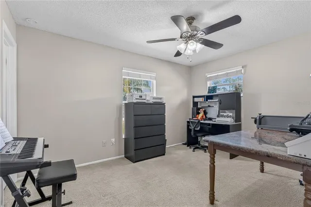 a workspace with a desk and a window