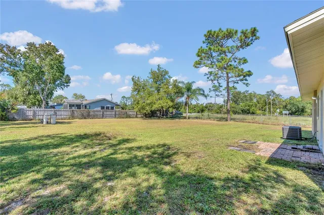 a view of a lake with a big yard