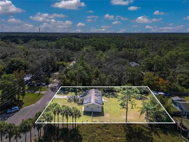 a view of a back yard from a balcony