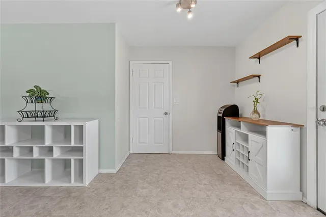 a view of an empty room with a window